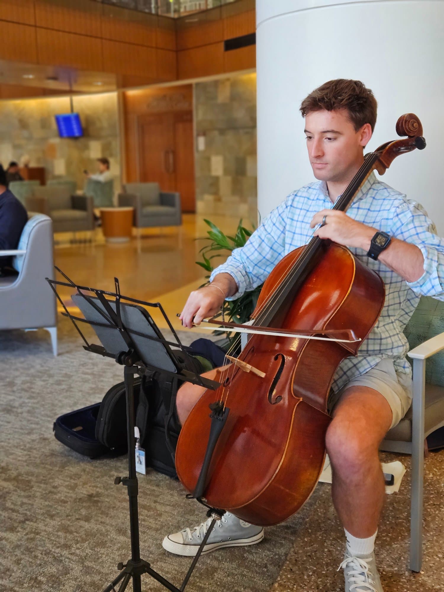 Cellist performing in hospital lobby