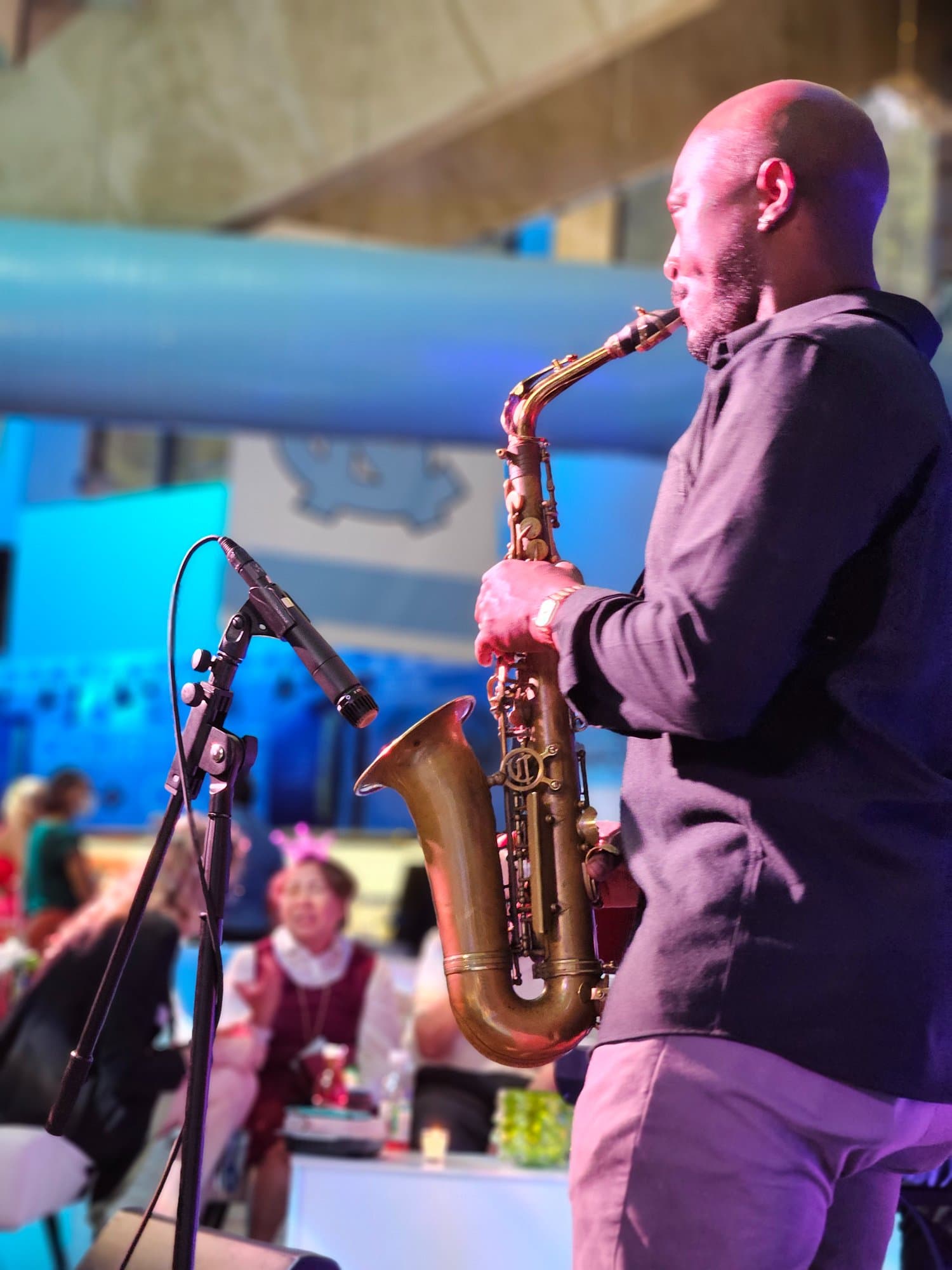 Saxophonist performing at institutional event